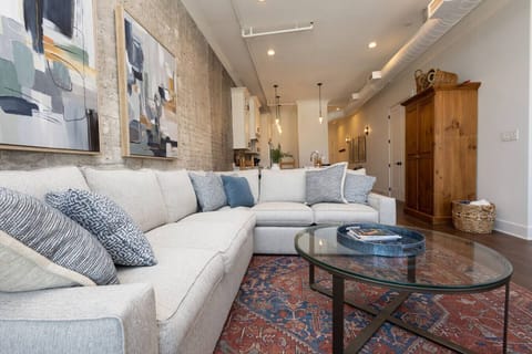 Living Room Oasis: Relax in style with plush seating and artistic decor in this inviting space!