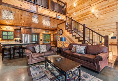 The open layout of the living room allows for easy flow between spaces, making it perfect for socializing or just spreading out and relaxing after a day of adventure.