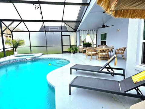 The pool is completely enclosed with privacy screens