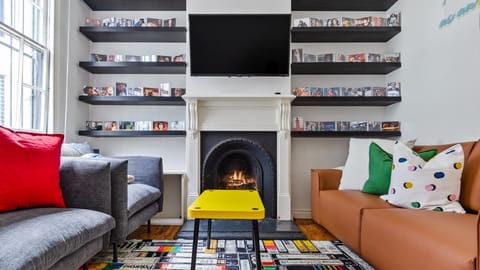 Welcome to Charming Inner-City Retreat in Trendy Surry Hills with a decorative fireplace.