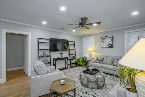 Living Room - lots of comfortable seating with a 65" Smart TV.
