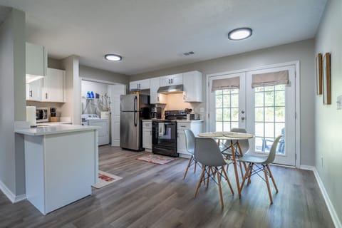 The laundry room is in the kitchen area