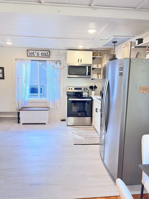 The white chest holds cards and games. Shoe rack