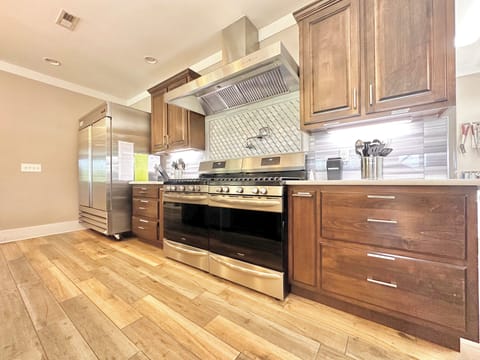 10 burners, commercial hood, double commercial fridge, 2 microwaves and 2 d/w's.