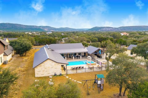 NOLA styled 6-bedroom home in Concan.  Sleeps 36 with AC, WiFi, Pool, Hot Tub House in Concan