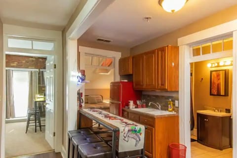Secondary kitchen with additional fridge and stove.