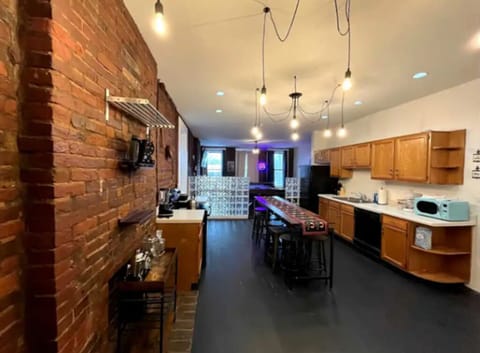 Primary kitchen with stove, dishwasher, full fridge. 