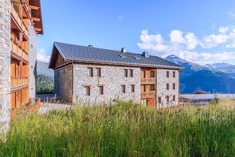 Bathed in sunshine and nestled in a peaceful meadow, this inviting stone retreat is perfect for a quiet summer getaway.