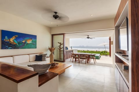 Experience luxury with this breezy open-air space, blending modern comfort and tropical charm with stunning ocean views.