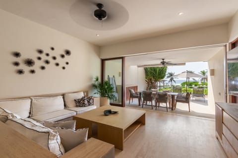 This tranquil seating area offers a perfect blend of indoor comfort and outdoor ambiance, with a direct view of the terrace.