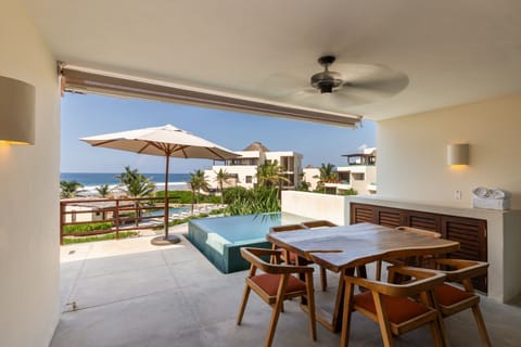 Unwind in your exclusive plunge pool and enjoy open-air dining with stunning beachfront scenery.