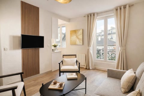 Living room setup includes a sofa for the good relaxation moments.