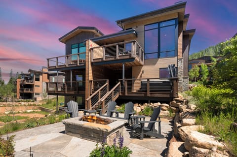 Breathtaking view of the backyard with firepit, lounge area, and a peek at the very rare Northern Lights.