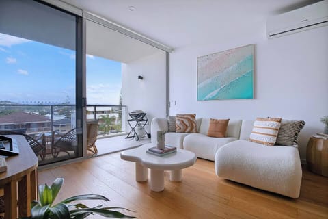 Sliding doors from the living area extend to a private balcony overlooking the Hinterlands.