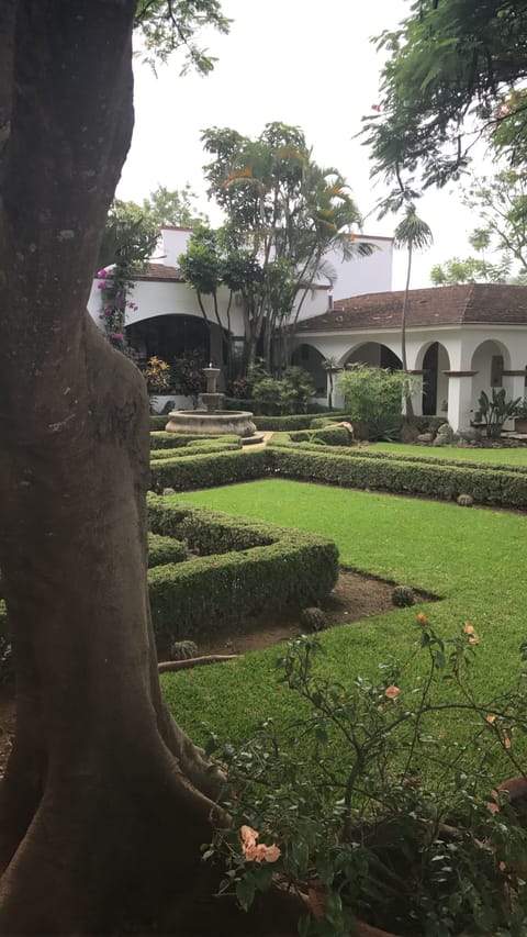 British and desert gardens with sculptures  throughout the enclosed property. 