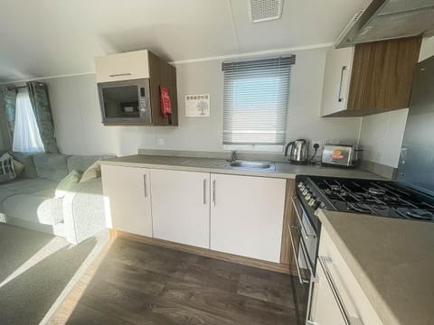 Spend quality time with your family on holiday at Hopton Holiday Village Norfolk, where the comfortable kitchen area of a caravan makes meal prep easy after a day at the Great Yarmouth beaches.