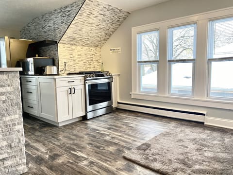 Cook on a commercial gas range with provided cookware. Microwave for snacks, pots, and pans on the l