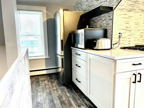 Full-size LG fridge, microwave for leftovers, and toaster for fresh toast—everything you need! Yum!