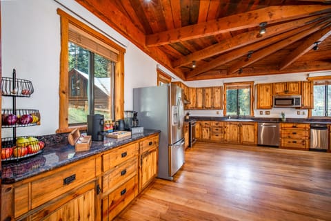 The kitchen is stocked with spices, condiments, and pantry goods.
