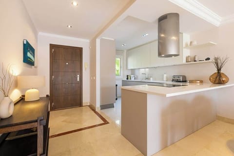 Sleek, modern kitchen with ample space, stylish decor, and natural light—perfect for preparing meals and gathering.







