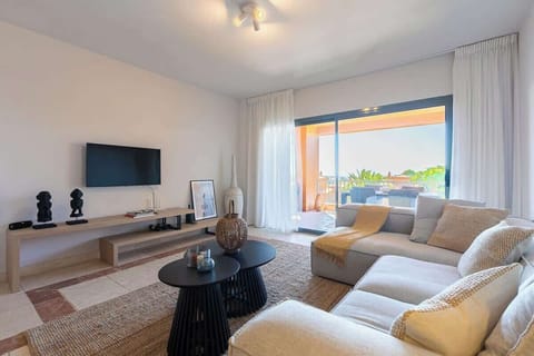 Living area with TV and WIFI, leading  directly onto the terrace. Integrated air conditioning and heating.