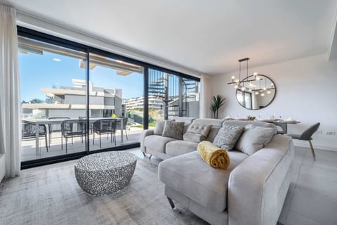 Bright and cozy living room with comfortable seating.