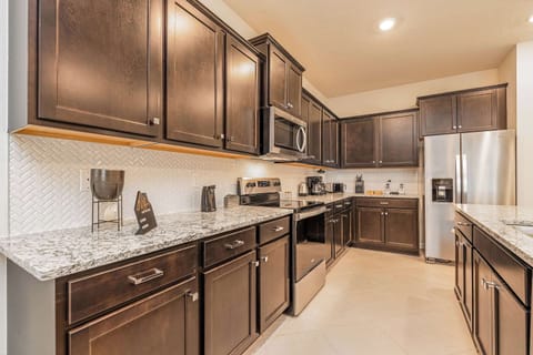 The spacious kitchen is fully-equipped with quality appliances.