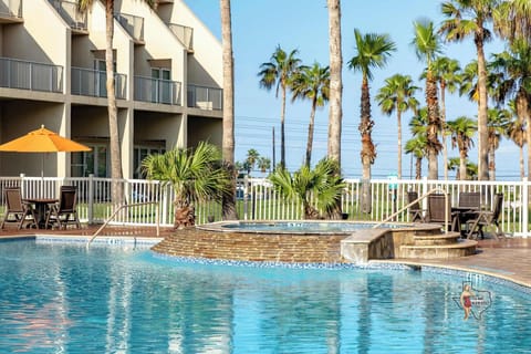 Poolside with shaded loungers.