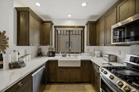 Stainless appliances, and a farm house sink.