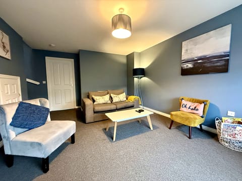 Living Room: Bright and inviting space with stylish seating and cheerful decor awaits you!