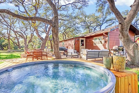 Soak in the private cowboy pool under the oak trees