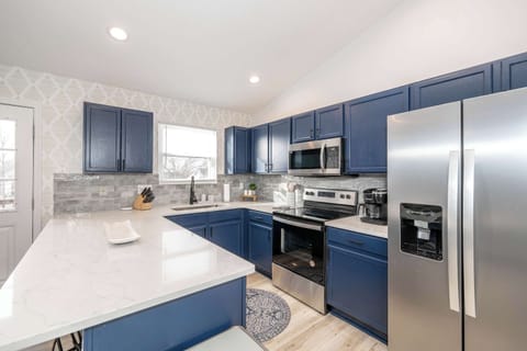 This serene kitchen offers ample space & all the comforts of home