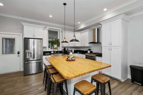 Sip morning coffee or enjoy a snack at the kitchen counter, with seating for 5