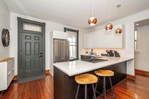 The sleek, open kitchen offers ample space & every home comfort