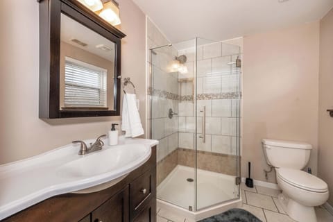The master ensuite boasts dual vanities & a spa-like glass shower