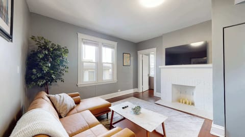 Enjoy a cozy movie night at home in Apartment 2’s tranquil living room