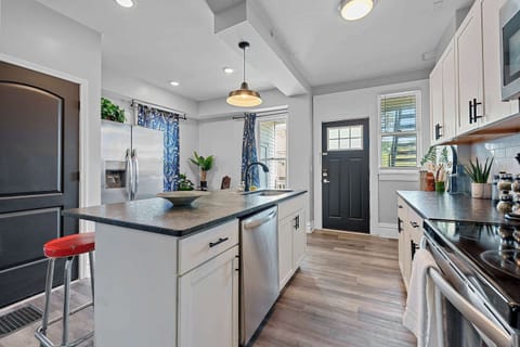 Apartment 1164’s open, airy kitchen offers ample space & every home comfort