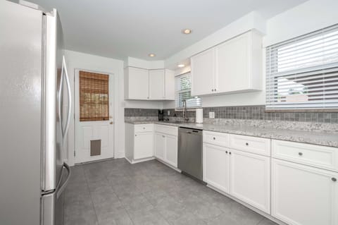 The large, airy kitchen is well-equipped for your visit