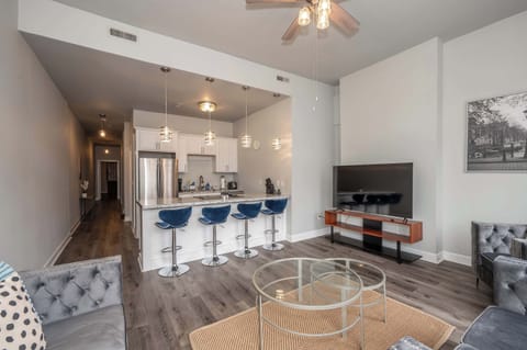 Whether you’re chilling at the counter or kicking back on the sofas, you’ll love relaxing in this modern condo