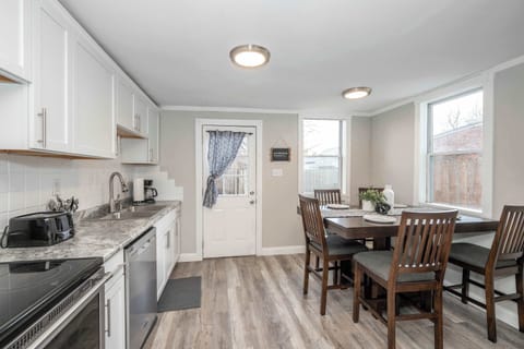 The bright, cozy kitchen offers ample space & all the comforts of home