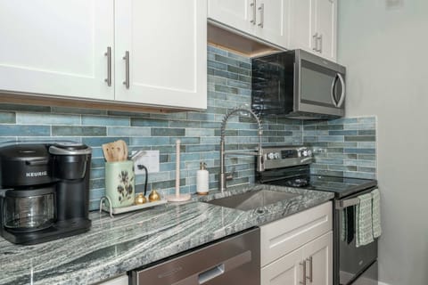 The sleek, fully equipped kitchen offers every comfort of home