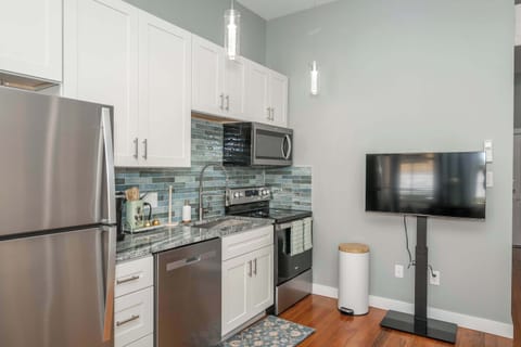 The sleek, fully equipped kitchen offers every comfort of home