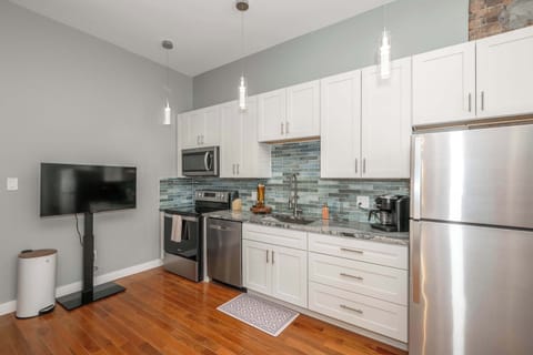 The sophisticated kitchen offers ample space & every home comfort