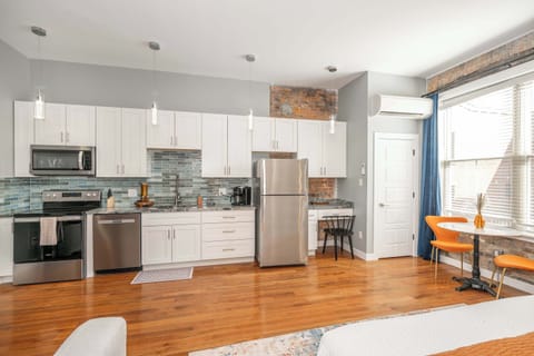 The sophisticated kitchen offers ample space & every home comfort