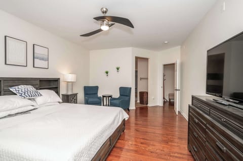 The 1st floor king suite boasts a Smart TV, walk-in closet, & private en suite