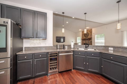 The open kitchen is spacious & fully-equipped with great amenities