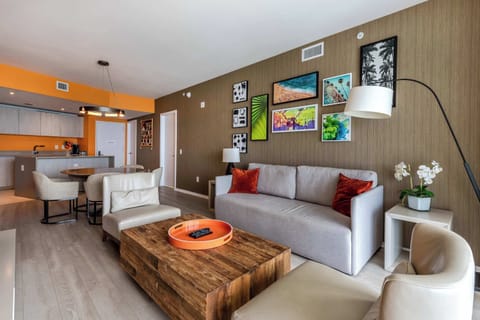 The living room offers a sofa that coverts to a sleep, TV, and balcony access