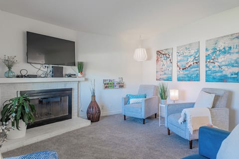Cozy and spacious living area with TV