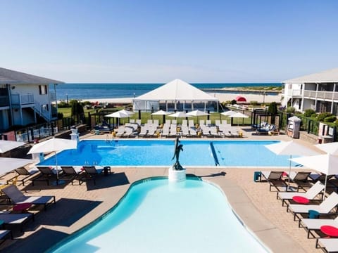 Dive into sparkling pools with ocean breezes all day.