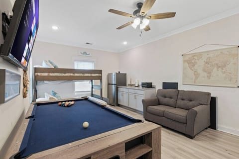 Spacious and versatile, this room is ideal for families or friends, featuring cozy beds and private amenities for added comfort.